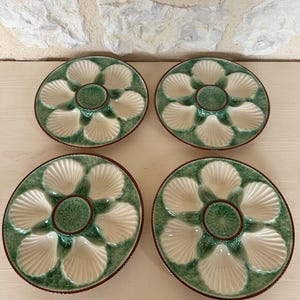 Four Longchamp Oyster Plates