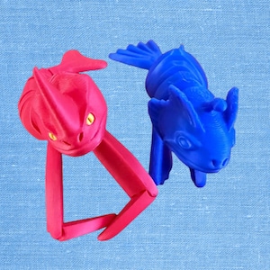 Monstruos marinos del mar, el monstruo rojo de ojos amarillos y el paquete del monstruo azul