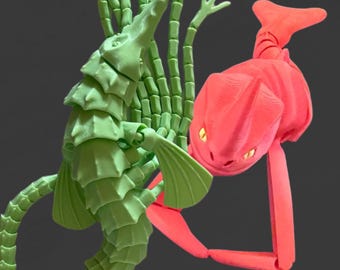 Red Bluster with yellow eyes and Brickleback Sea Beasts, Flexible Sea Monsters Fidget Toys