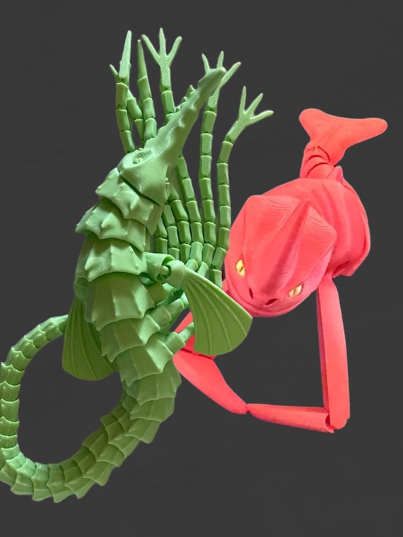 Red Bluster with yellow eyes and Brickleback Sea Beasts, Flexible Sea Monsters Fidget Toys