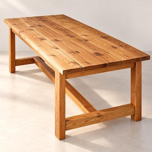 May include: A rectangular dining table constructed from light brown wood with a visible grain and natural knots. The tabletop consists of four parallel planks supported by four sturdy legs connected by a horizontal crossbar frame.