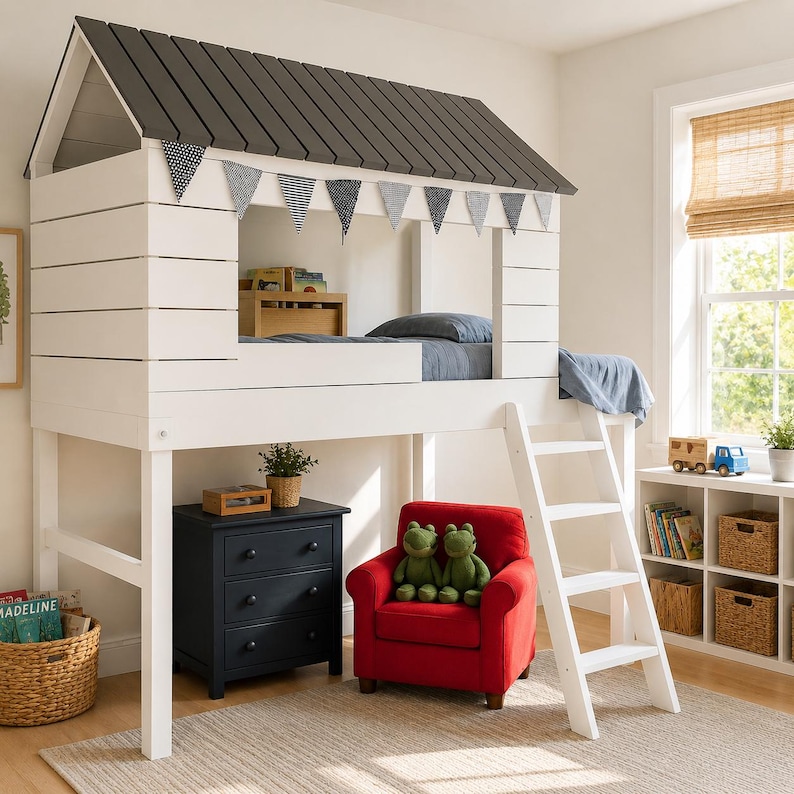 May include: A white loft bed with a house-shaped frame and a gray roof. The bed has a ladder, a red armchair, and a navy blue dresser. Decorative bunting hangs from the bed's window.