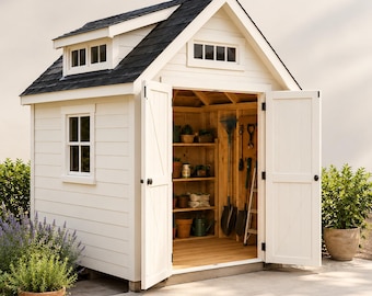 May include: A white wooden garden shed with a black shingled roof, a side window, and double doors standing open. The interior features wooden shelving units holding various gardening pots and tools, including a rake, shovel, and a small ladder.