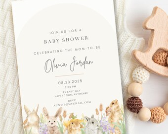 May include: Baby shower invitation with watercolor illustrations of bunnies and floral accents. The invitation includes the text "Join us for a Baby Shower Celebrating the Mom-to-Be" and details for Olivia Jordan's baby shower.