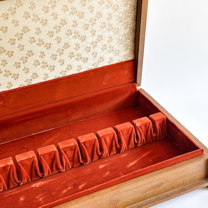 May include: A set of three ceramic mugs with a speckled, matte finish. The mugs are in shades of cream, light gray, and dark gray. Each mug has a simple, minimalist design, perfect for coffee or tea.