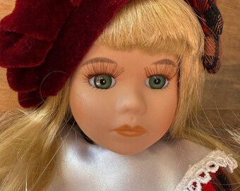 Vintage collectible porcelain doll in a Scottish style.