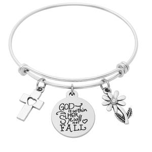 May include: A silver-colored bangle bracelet with three charms. The charms include a cross with a heart cutout, a round pendant with the text "GOD is within HER she will NOT FALL", and a daisy flower with a rhinestone center.