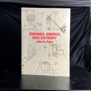 May include: A hardcover book titled "Engines, Energy, and Entropy" by John B. Fenn. The cover is off-white with red text and detailed line drawings of mechanical devices. The book is displayed on a dark surface.