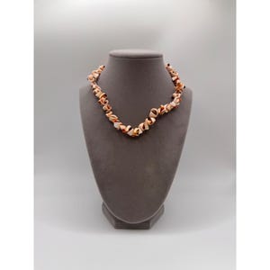 May include: A rustic wooden sign with the text "Welcome to our home" in white lettering. The sign features a distressed finish and a simple, inviting design, perfect for front door decor.