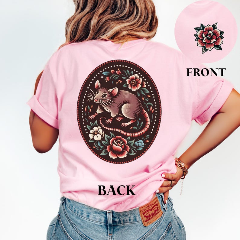 May include: Pink t-shirt with a floral design featuring a rat and the word "BACK" printed on the back.