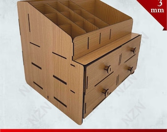 May include: A wooden organizer with two drawers and a top shelf with multiple compartments. The organizer is made of light brown wood with black lines. The organizer is designed for 3 mm thick wood.