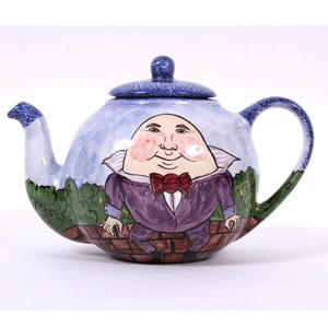 Vintage Blue Humpty Dumpty Teapot by Nola Watkins. Handmade in Virginia - signed and dated 2000 by Ms. Watkins. Approx. 6.5&quot;H, holds 8 cups.