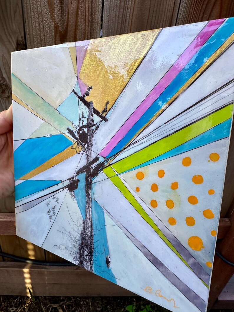 May include: Abstract painting on a square canvas with a central image of a utility pole with wires and a bird's nest. The background is a mix of geometric shapes in shades of blue, green, pink, and gold. The painting is signed in the lower right corner.
