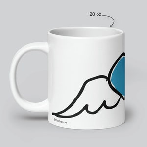 May include: White ceramic mug with a black and blue wing design. The mug is 20 ounces and has the text "@thebevco" on the bottom.