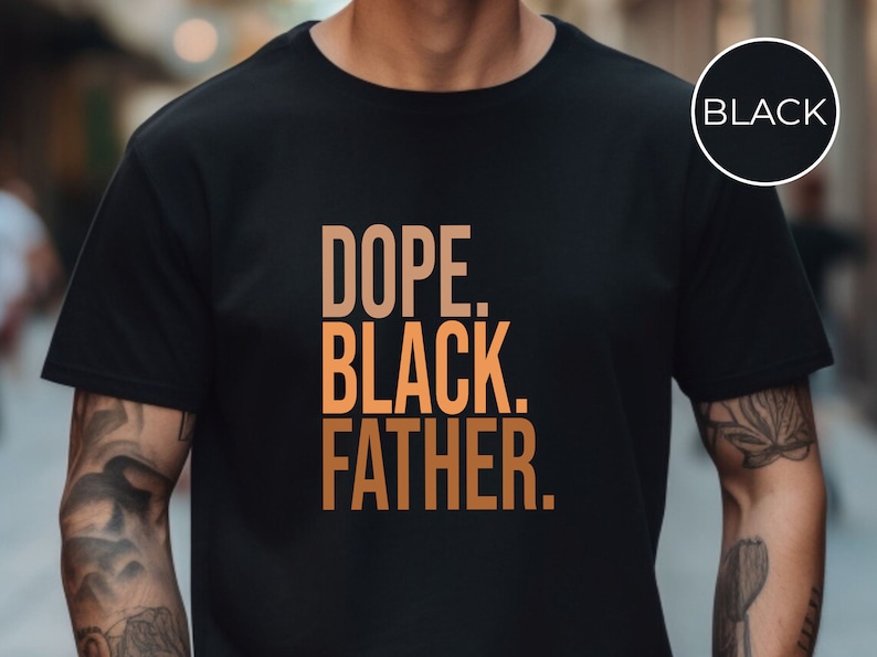 May include: Black t-shirt with the words "DOPE. BLACK. FATHER." in a gradient orange font. The shirt has a crew neck and short sleeves. A black circle with the word "BLACK" is in the upper right corner.