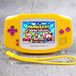 Custom Pastel Yellow Game Boy Advance IPS M2 – Neon Magenta Buttons, USB-C Battery & Audio Amp + LED Upgrades, Includes Case and Earphones