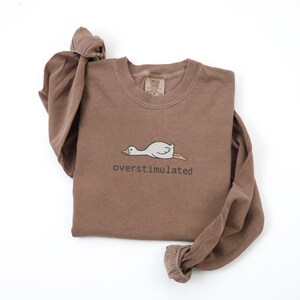Embroidered Silly Goose Shirt Comfort Colors Overstimulated Shirt Meme Shirt Just A Silly Goose Shirt Funny overstimulated frog, overstimulated goose, overstimulated shirt, silly goose shirt, funny humor shirt, sarcasm shirt, funny goose shirt, got too silly shirt, funny goose gift, embroidered goose, silly goose meme, funny meme shirt, silly goose crewneck