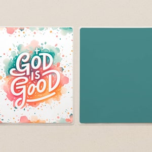 May include: A planner cover with the words "GOD IS GOOD" in white script with a cross, set against a watercolor background of teal, pink, and orange. The opposite side is a solid teal color.