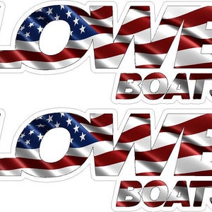May include: Two white decals with the word "LOVE" in red, white, and blue American flag colors. The word "BOATS" is below the word "LOVE" in white with a red, white, and blue American flag background.