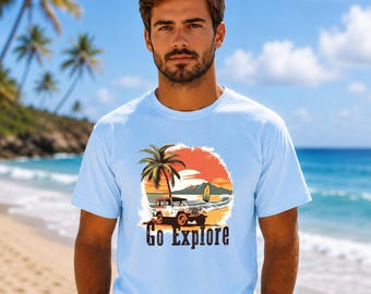 May include: A light blue t-shirt featuring a graphic print of a white off-road vehicle parked on a beach near a palm tree and a surfboard. The design includes a sunset background and the text Go Explore in a dark, bold, sans-serif font.
