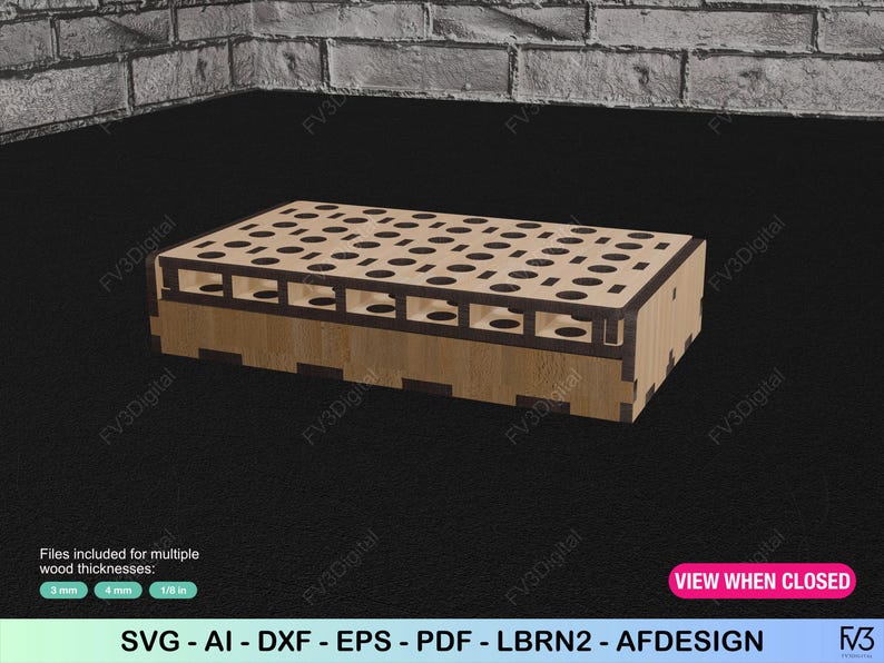 K&ouml;nnte beinhalten: Eine Holzbox mit Laser-Cut-Design, mit zahlreichen kreisf&ouml;rmigen &Ouml;ffnungen auf der Oberseite und rechteckigen Aussparungen an den Seiten. Die Box ist aus hellem Holz gefertigt und hat ein geometrisches Muster. Der Text "VIEW WHEN CLOSED" ist sichtbar.