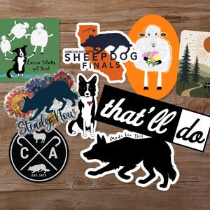 May include: A collection of stickers featuring sheepdogs and sheep. Designs include a dog with sheep, a California map with text, a sheep holding flowers, a landscape, a holographic dog with text, a dog with a heart, and text reading that'll do.