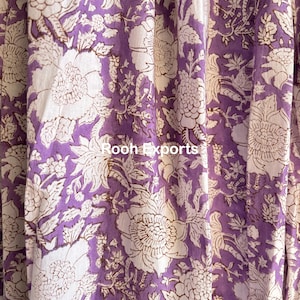 May include: Purple fabric with a white floral pattern. The fabric has a subtle sheen and a soft texture.