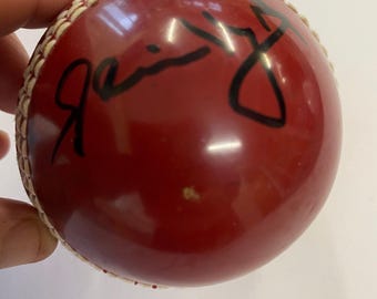 Cricket red ball personally signed by Sir Clive Lloyd
