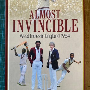 May include: Book cover titled "Almost Invincible" with images of cricket players. The cover features a vintage design with the title in large, bold letters. The book's subtitle reads "West Indies in England: 1984."