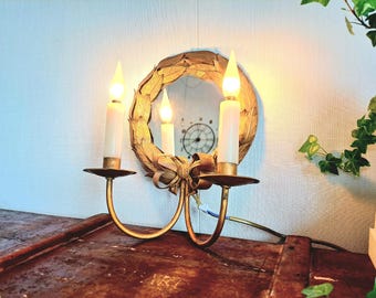 Espejo de pared antiguo con 2 velas eléctricas.