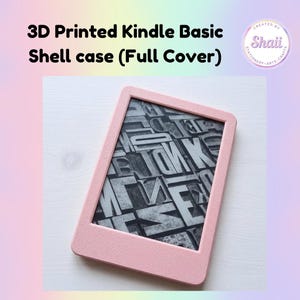 May include: A light pink 3D printed Kindle Basic shell case with a full cover design. The screen displays a black and white graphic pattern of various overlapping letters and typography characters in different orientations and sizes.