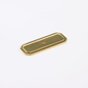 May include: A rectangular brass cabinet pull with an octagonal border. The hardware has a small hole in the center for a screw. The finish is a shiny gold color.