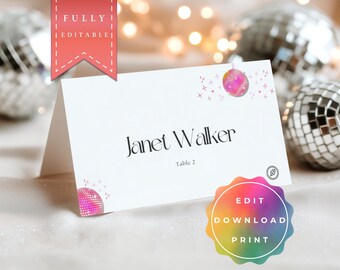 May include: White place card with the name "Janet Walker" and "Table 2" printed in black. The card is decorated with pink disco ball graphics and starbursts. A red banner reads "FULLY EDITABLE".