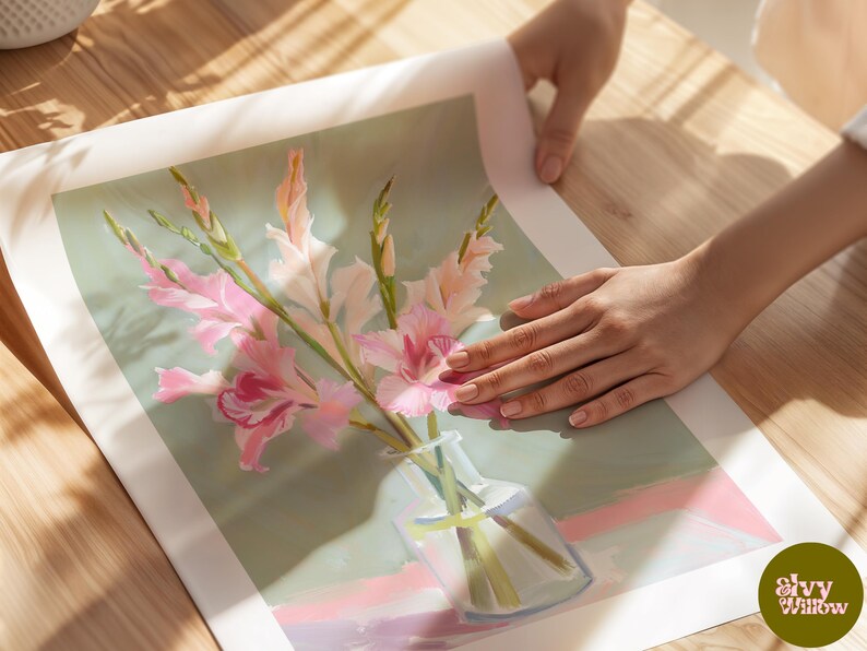 May include: A painting of a bouquet of pink and white gladioli flowers in a clear glass vase on a light green background.