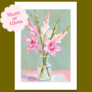 May include: A painting depicting a bunch of pink gladioli in a clear glass vase. The flowers are arranged simply and elegantly, with a soft, muted green background.