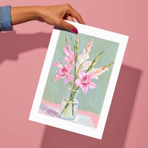 May include: A painting of a bouquet of pink and white gladioli in a clear glass vase against a green background.