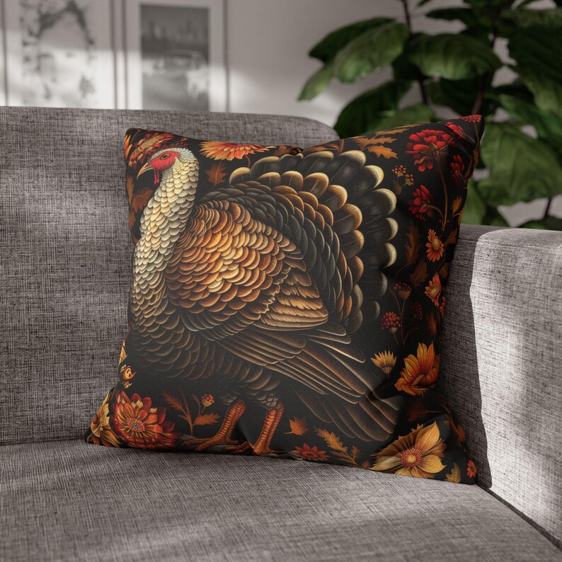 May include: A decorative throw pillow with a black background featuring a detailed illustration of a turkey surrounded by colorful flowers. The turkey is brown, gold, and black with a red wattle.