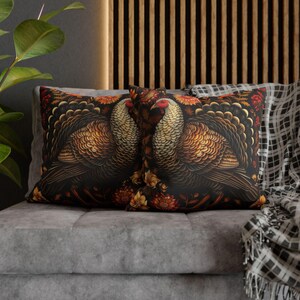 May include: Two decorative throw pillows with a dark background featuring a detailed illustration of two turkeys with gold and brown feathers. The pillows have a floral pattern with red, orange, and yellow flowers.