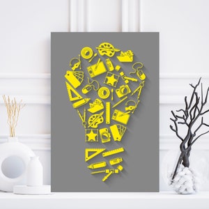 May include: A gray background with a yellow lightbulb shape made up of various school and art supplies, including a ruler, paintbrush, compass, and camera.