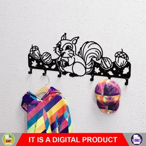 May include: Black metal wall-mounted coat rack featuring a squirrel design with acorns and leaves. The rack has multiple hooks for hanging items. A colorful jacket and a patterned baseball cap are hanging below. The text "IT IS A DIGITAL PRODUCT" is at the bottom.