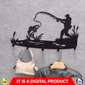 May include: Black metal wall-mounted coat rack with a fisherman silhouette reeling in a fish. The rack has four hooks and aquatic plant detailing. A purse and jacket hang from the hooks. The text "IT IS A DIGITAL PRODUCT" is displayed.