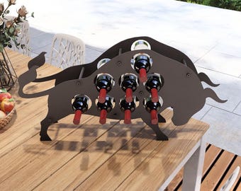 May include: A black metal wine rack shaped like a bull, holding 10 bottles of wine. The rack is sitting on a wooden table.
