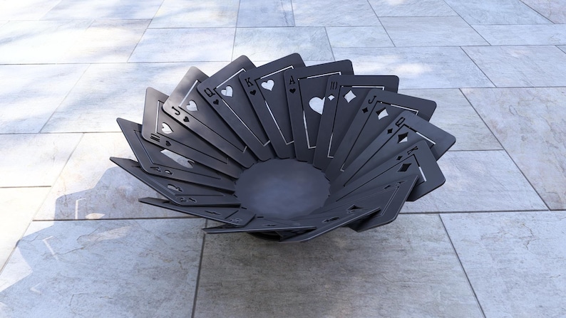 May include: A decorative, dark gray bowl crafted from playing card shapes. The bowl features a circular base and the cards are arranged in a fan-like pattern, showcasing the suits of hearts, diamonds, clubs, and spades.
