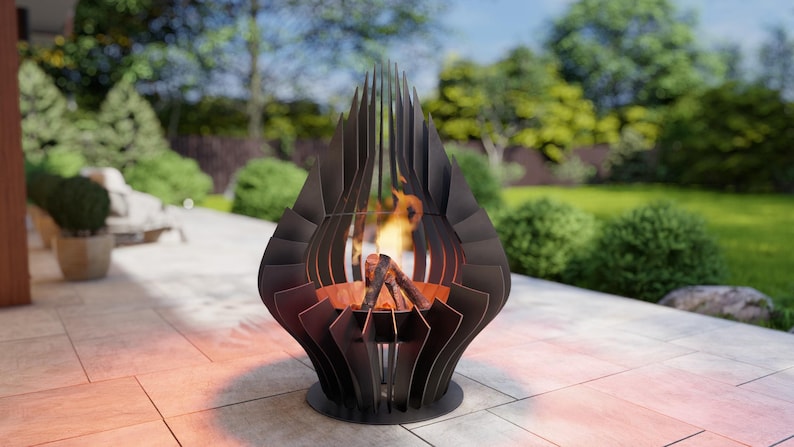 May include: A black, modern outdoor fire pit with a unique, layered design. The fire pit has a circular base and a tall, open structure with flames visible inside. The background shows a patio and a green yard.