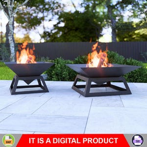 May include: Two black metal fire pits with a triangular base and a wide, round bowl. The fire pits are on a gray tiled patio with green bushes in the background. The fire pits are lit with flames and logs.