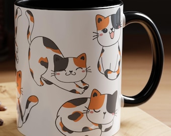 May include: White ceramic mug with a black rim and handle. The mug features a repeating pattern of cartoon calico cats in various poses.