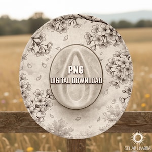 May include: A beige cowboy hat with a floral design and the text "PNG DIGITAL DOWNLOAD". The hat features a wide brim and a central indentation. The floral pattern includes blossoms and leaves.