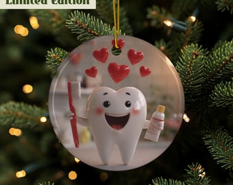 May include: A round Christmas ornament featuring a smiling cartoon tooth holding a red toothbrush and a tube of toothpaste. Red hearts float above the tooth. The ornament has the text "Limited Edition" in a green box.