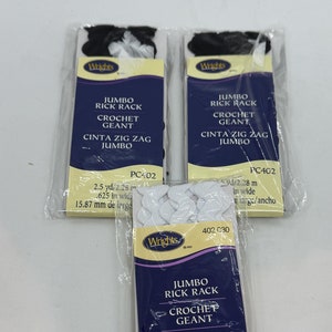 May include: Three packages of white jumbo rick rack crochet trim with black text that reads "Jumbo Rick Rack Crochet Geant Cinta Zig Zag Jumbo" and "PC402" with measurements in yards and inches.