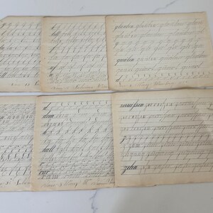 May include: A collection of six antique handwritten documents. The aged papers display cursive script in black ink, with visible lines and faded edges. The documents appear to be practice sheets or notes, with some text partially legible.